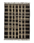 Tapis en laine tissé main motif graphique noir et beige frangé