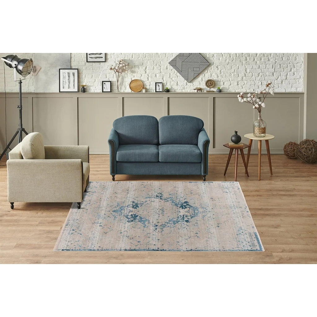 Tapis oriental beige et bleu avec motif central rectangulaire et look distressed