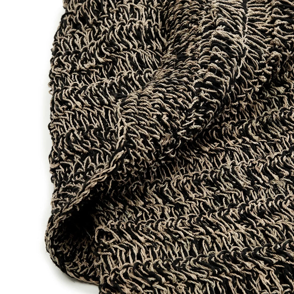 Textured woven fabric du tapis rond en jonc de mer noir 150 cm