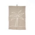 Serviette en lin beige avec motif palmier brodé blanc cassé