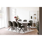 Table de salle à manger moderne avec chaises vert foncé et base métal noir