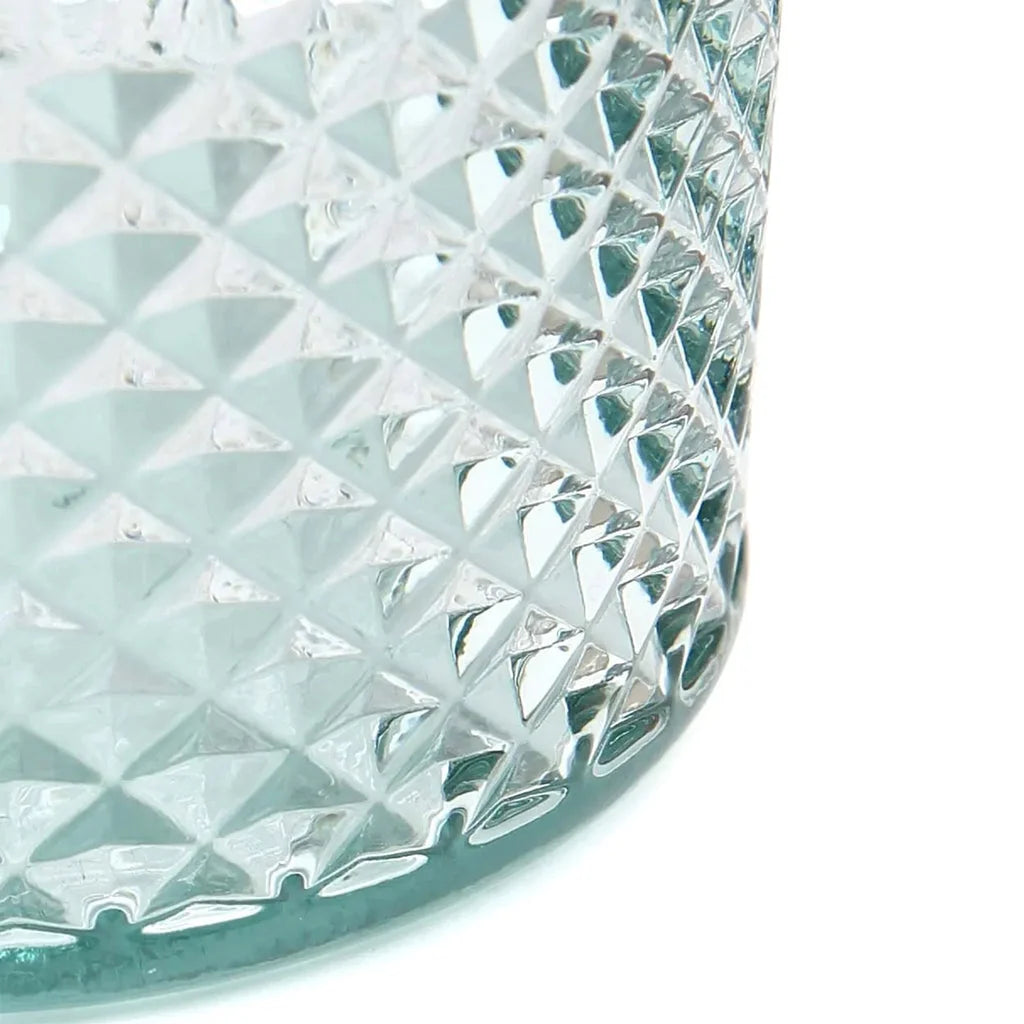 Récipient en verre texturé.